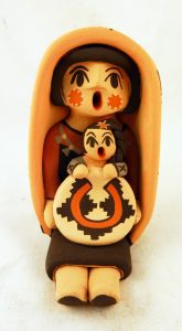 A Jemez Pueblo storyteller figurine with one child by Chrislyn Fragua