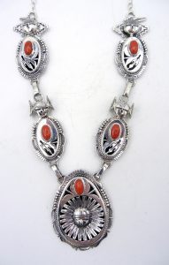 Navajo sterling silver and coral maiden and sunface necklace by Bennie Ration