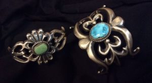 Sandcast cuff bracelets in sterling silver and turquoise by Navajo silversmith Eugene Mitchell