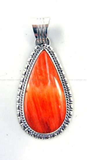 Navajo orange spiny oyster shell and sterling silver pendant by Will Denetdale
