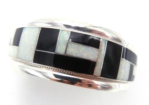 Zuni jet, lab opal, and sterling silver channel inlay cuff bracelet by Rickel and Glendora Booqua