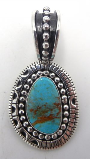 Navajo Kingman turquoise and sterling silver applique pendant by Johnathan Nez