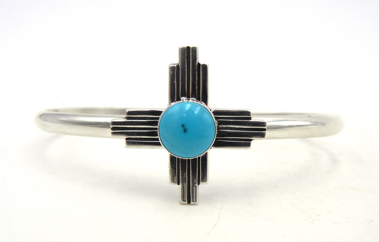 Navajo sterling silver and turquoise Zia symbol cuff bracelet.