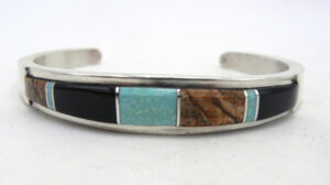 Navajo multi-stone and sterling silver channel inlay cuff bracelet with turquoise, jet, and jasper by Kyle Yellowhair