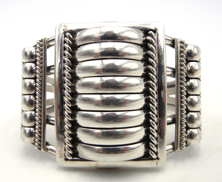 Navajo sterling silver domed three panel cuff bracelet by Thomas Charley