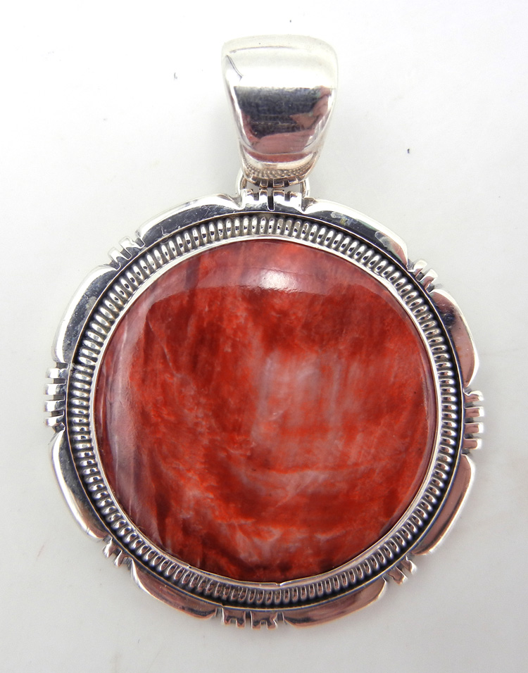 Navajo red spiny oyster and sterling silver round pendant by Rydell Billie