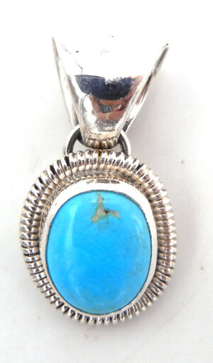 Navajo small turquoise and sterling silver pendant by Rydell Billie