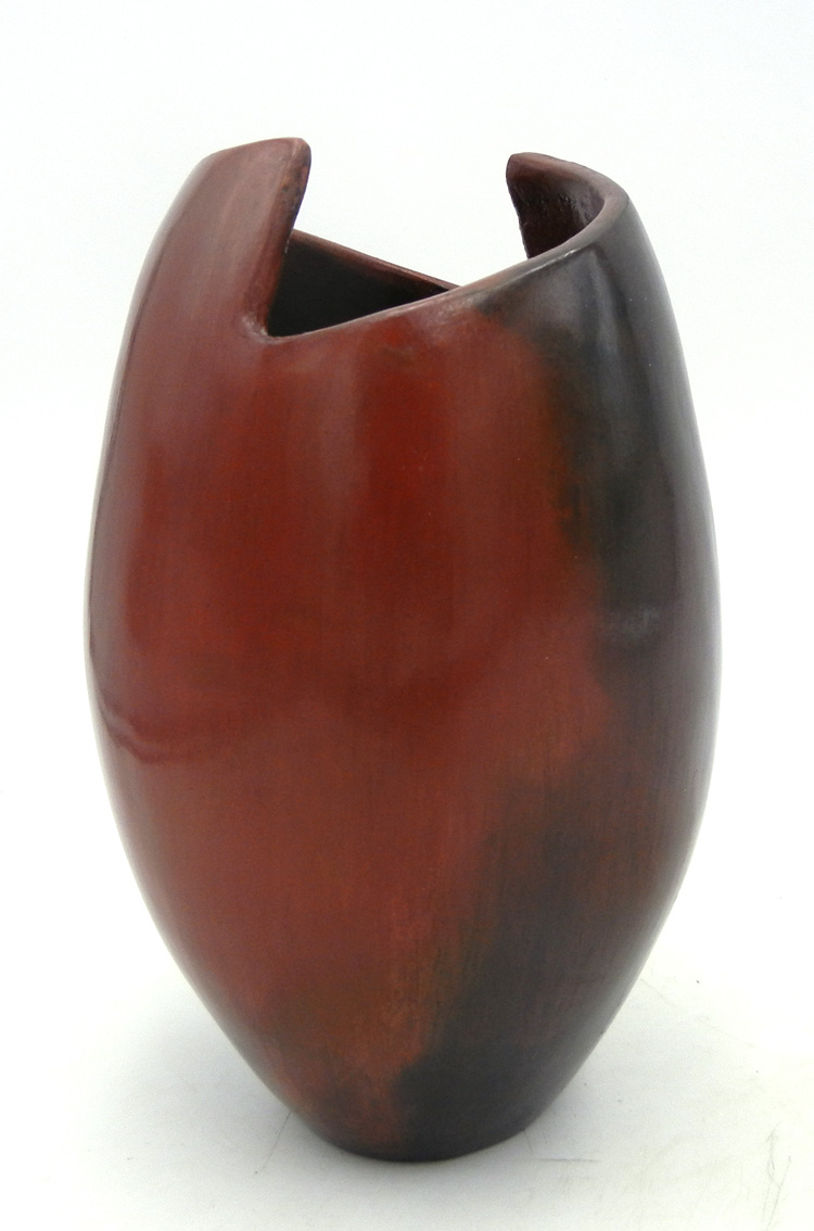 Navajo handmade pine pitch vase with curved, cut out rim by Alice Cling