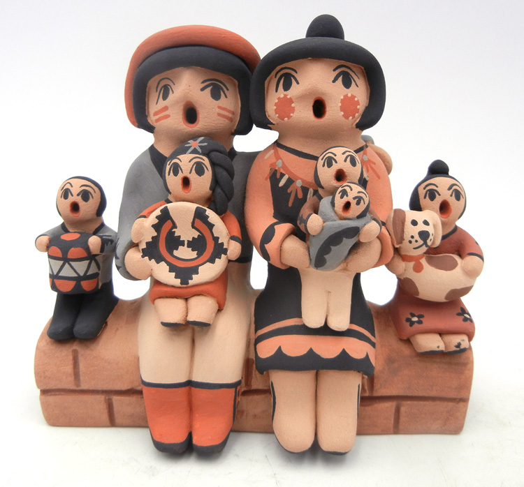 Jemez handmade and hand painted seated family of seven with dog storyteller figurine by Chrislyn Fragua