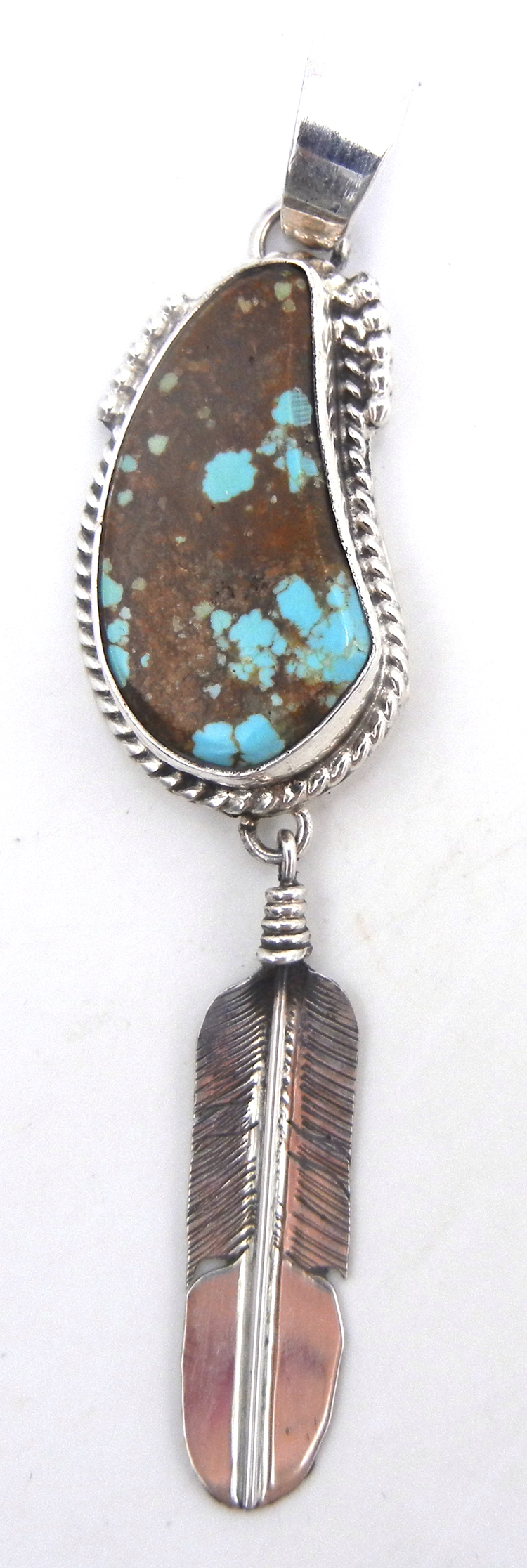 Navajo turquoise and sterling silver feather dangle pendant by Bennie Ration