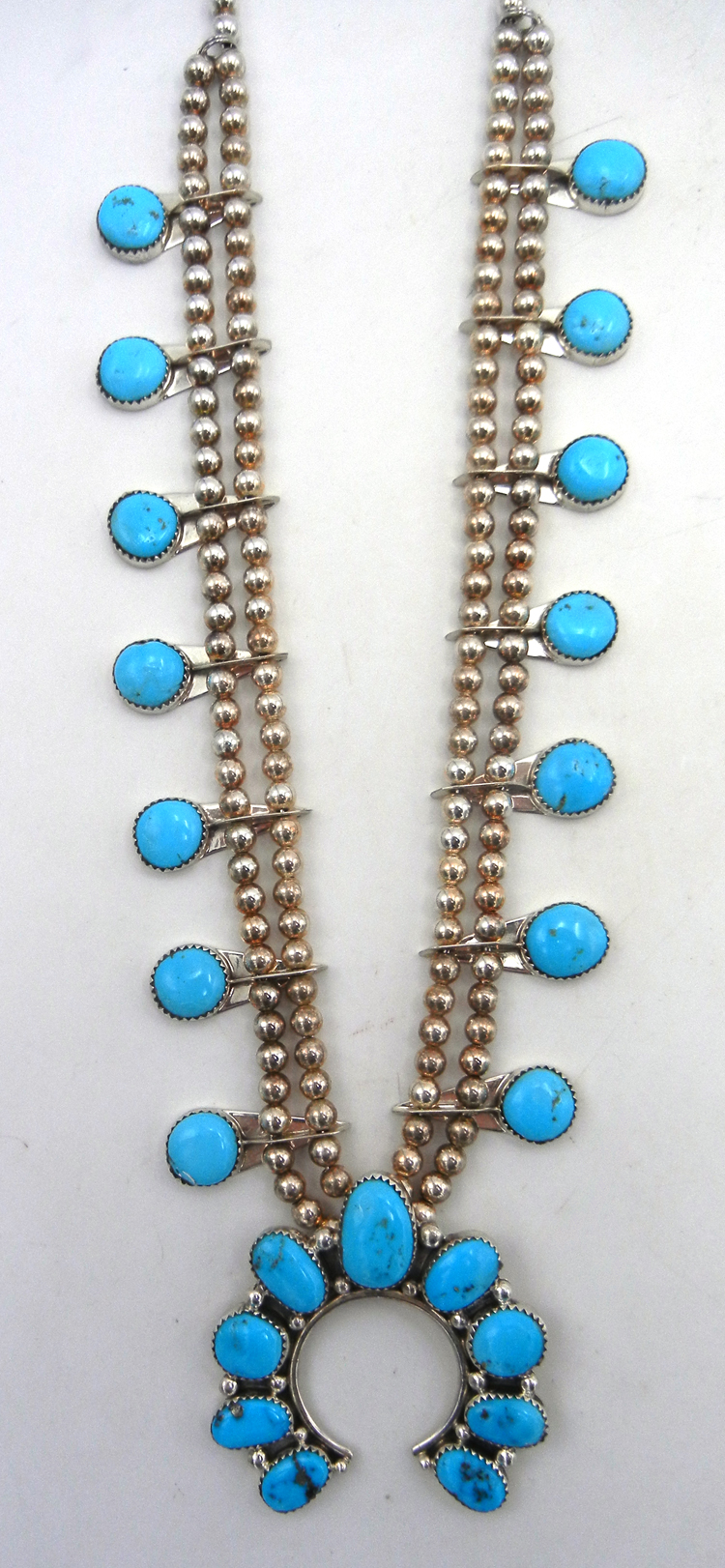 Navajo turquoise and sterling silver contemporary squash blossom necklace
