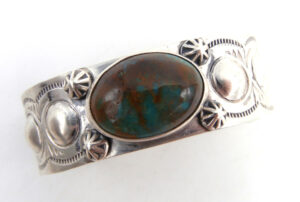 Navajo green turquoise and sterling silver cuff bracelet with repousse, applique and stamped designs
