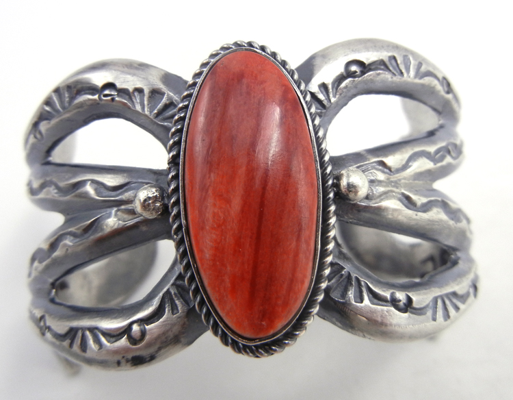 Navajo sandcast sterling silver and red spiny oyster shell cuff bracelet by Eugene Mitchell