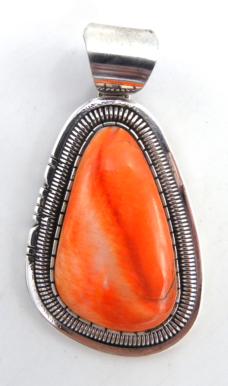 Navajo orange spiny oyster shell and sterling silver pendant by Walter Vandever