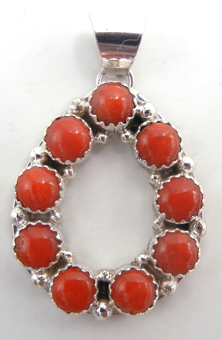 Navajo coral and sterling silver cut out tear drop pendant