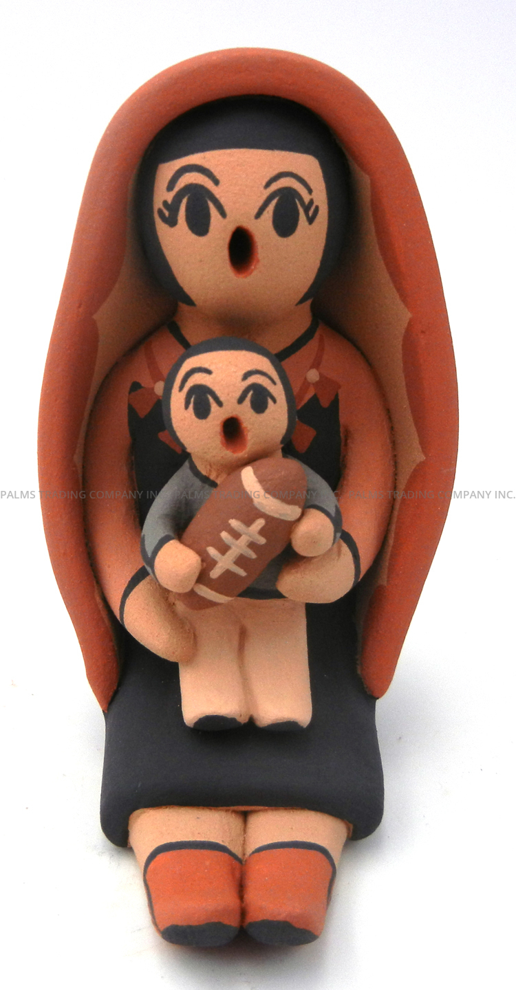 Jemez small seated storyteller with one child holding football by Anissa Fragua
