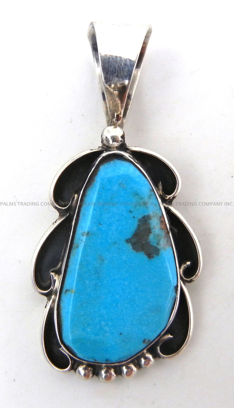 Navajo small turquoise and sterling silver pendant by Juan Guerro