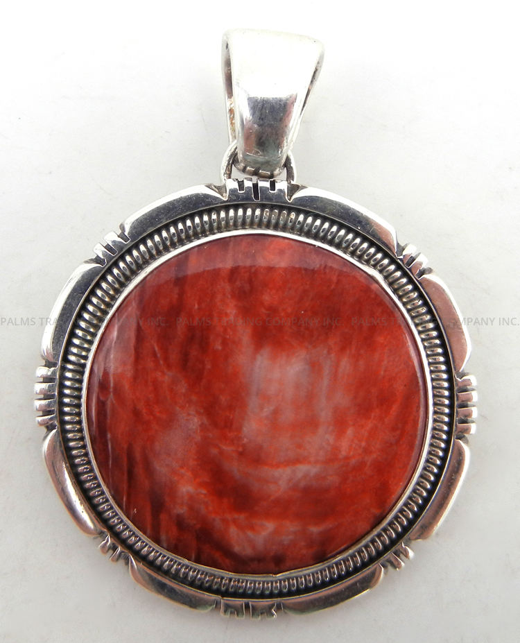 Navajo round red spiny oyster shell and sterling silver pendant by Wydell Billie