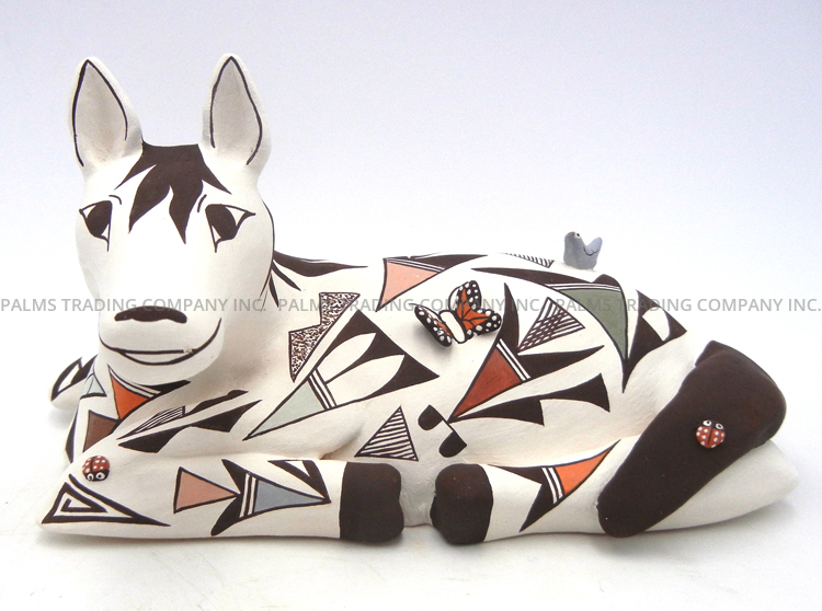 Acoma handmade and hand painted polychrome laying down horse figurine by Judy Lewis
