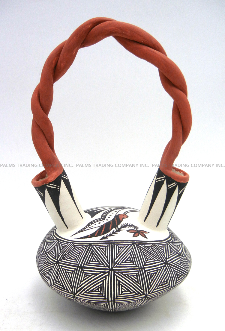 Acoma handmade and hand painted polychrome fine line and butterfly wedding vase with twisted handle by Ruth Estevan