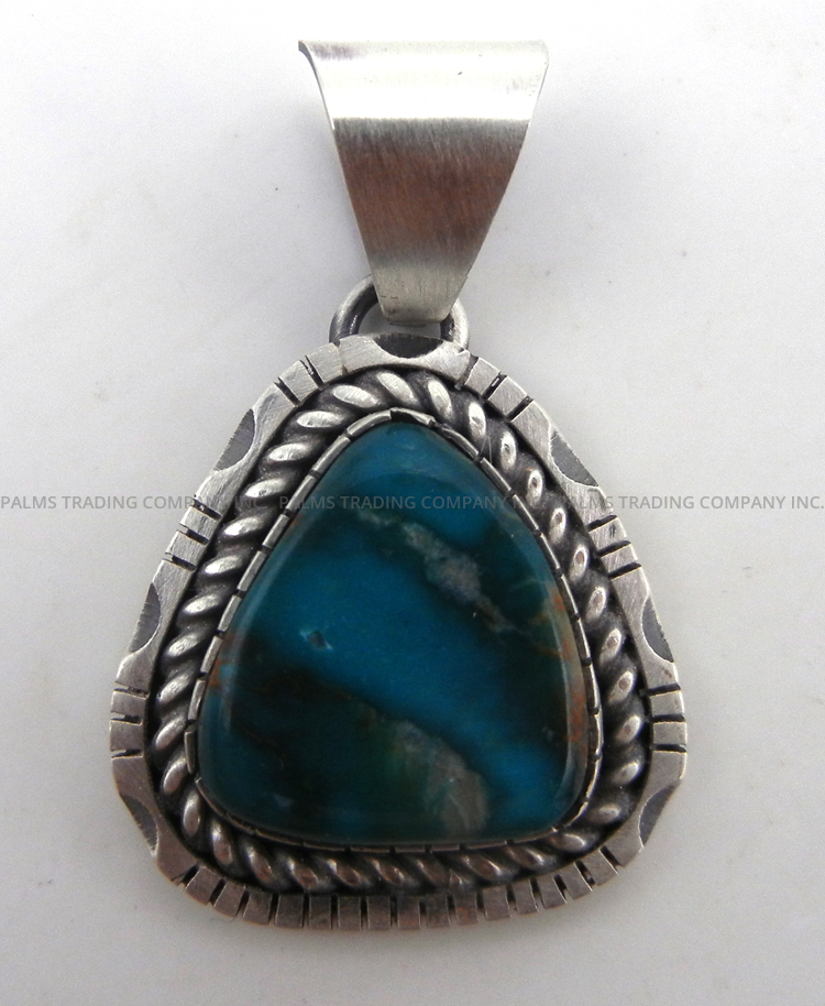 Navajo small triangular turquoise and sterling silver pendant by Walter Vandever