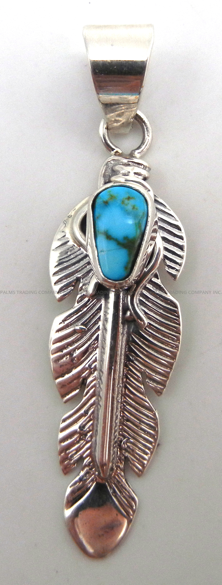 Navajo sterling silver and turquoise feather pendant by June Delgarito
