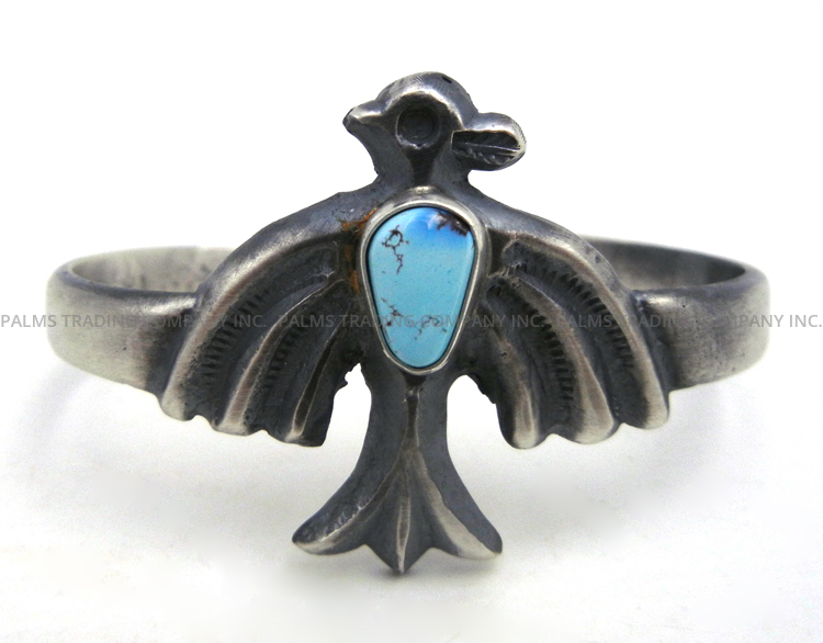 Navajo sandcast sterling silver and turquoise thunderbird cuff bracelet by Harrison Bitsue