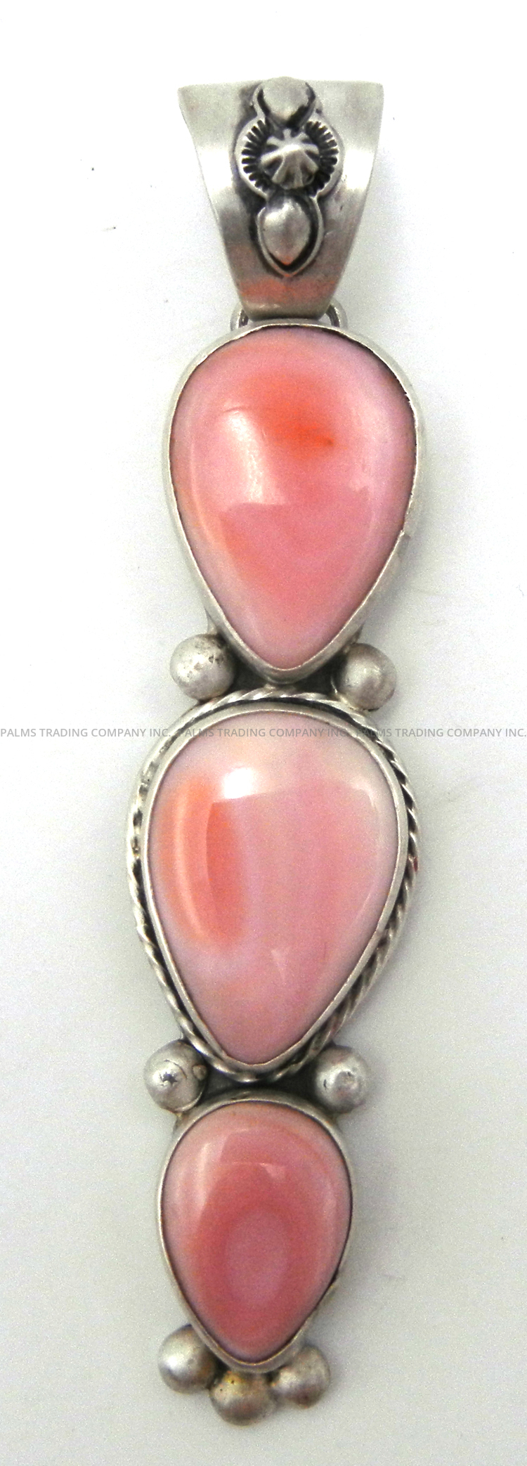 Navajo triple pink conch and sterling silver pendant by Francis Fred