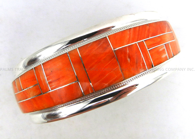Zuni orange spiny oyster shell and sterling silver inlay cuff bracelet by Glendora and Rickel Booqua