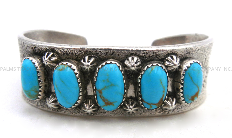 Navajo sandcast sterling silver and turquoise row cuff bracelet
